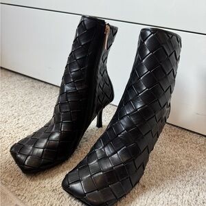 Stylish Black Heeled Boots with Pointed Toe and Unique Design